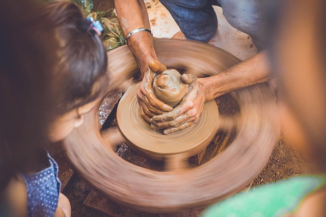 pottery wheel throwing tall vase